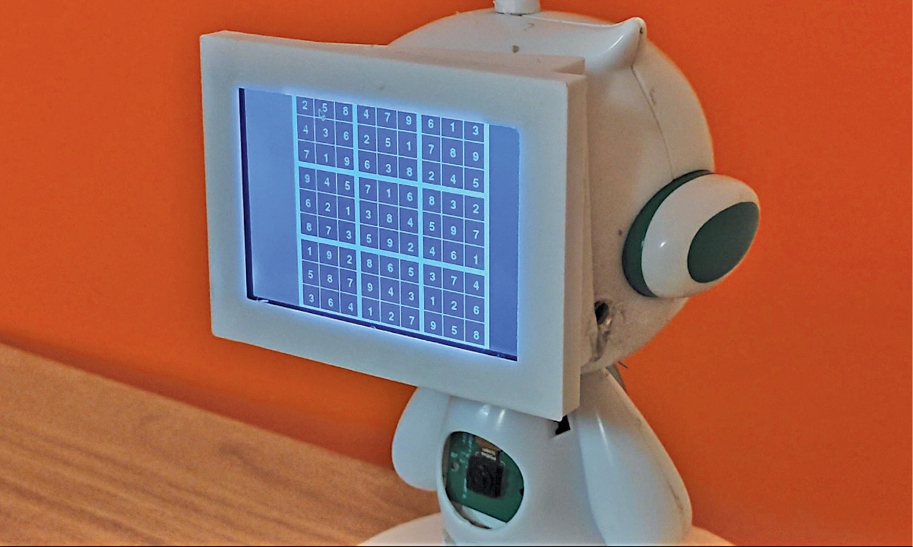 The robot solving the puzzle