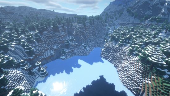 Minecraft Christmas seeds - 5488656216511509290: sun rays pour over snow-topped mountains and a frozen lake