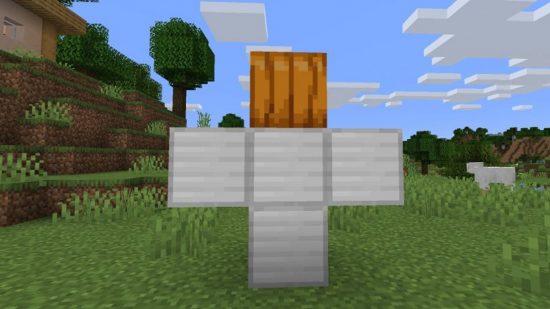 How to make a Minecraft iron golem: four iron blocks in a t-shape with a pumpkin on top, to display where a carved pumpkin or jack o'lantern should be placed