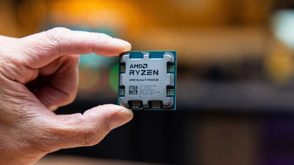 AMD Ryzen 9 7950X held in a hand