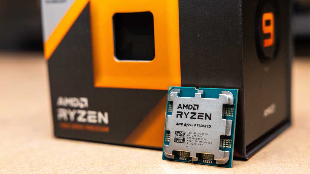 AMD Ryzen 9 7950X next to its box (close-up)