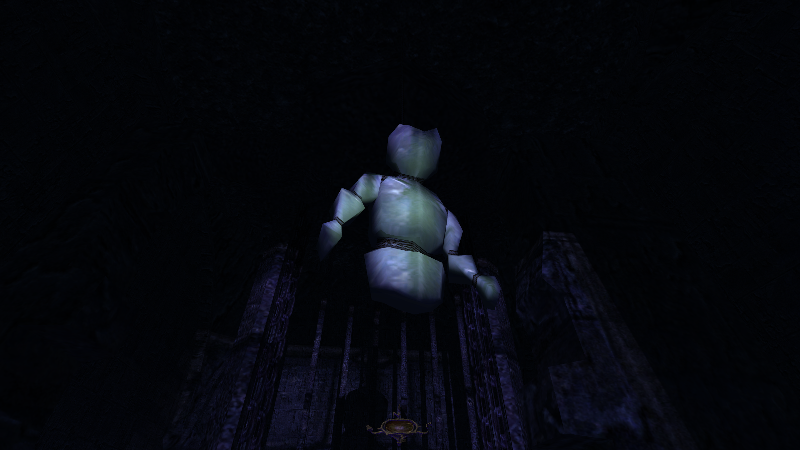 A mannequin hanging in the dark