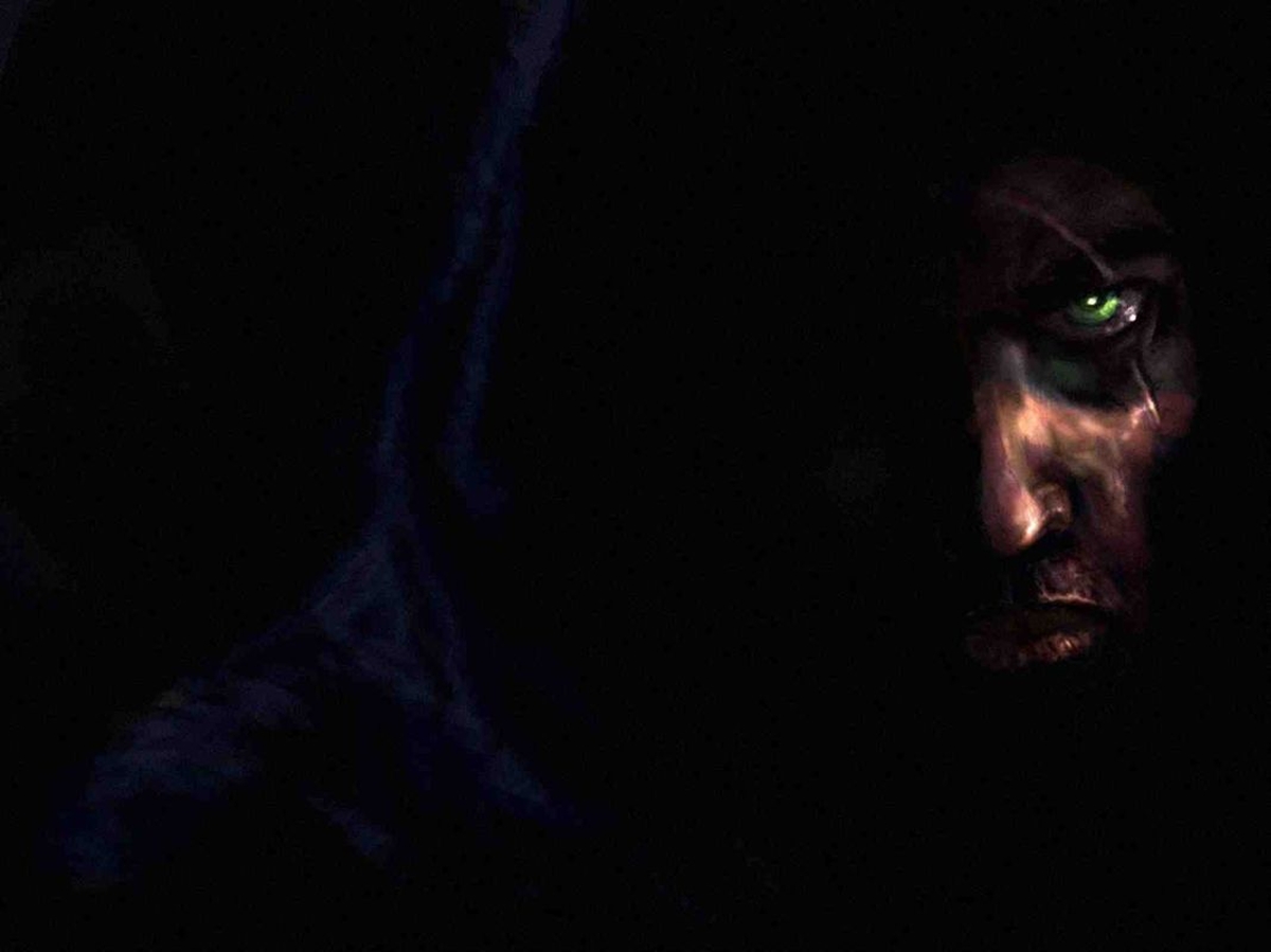 Garrett's face, half in darkness